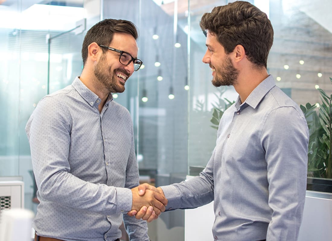 About Our Agency - Two Business People Shaking Hands